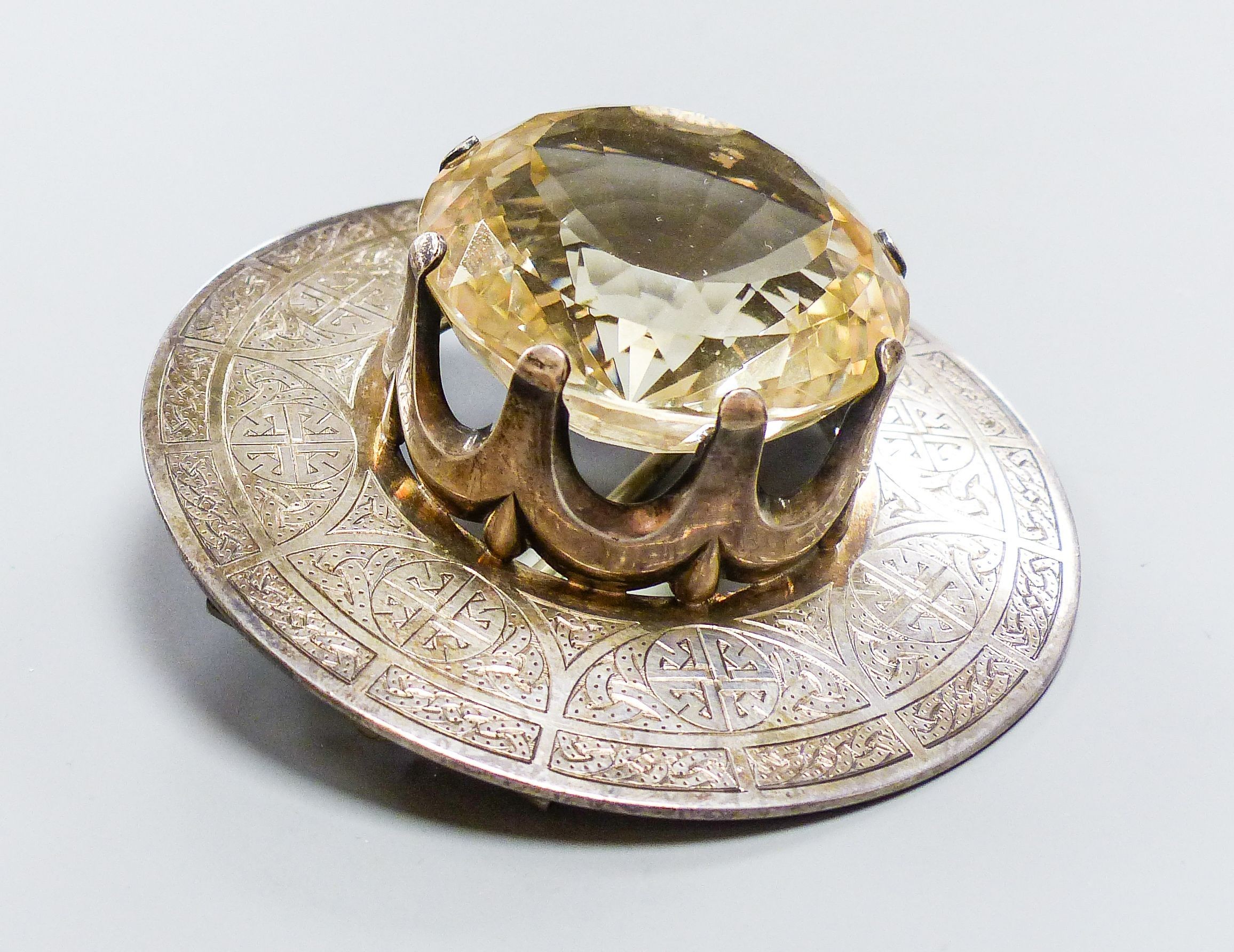 A late Victorian Scottish silver and large cairngorm set circular brooch, Robert & Henry Bruce Kirkwood, Edinburgh, 1892, diameter 81mm, gross weight 134.4 grams.